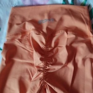 Orange booty scrunch leggings